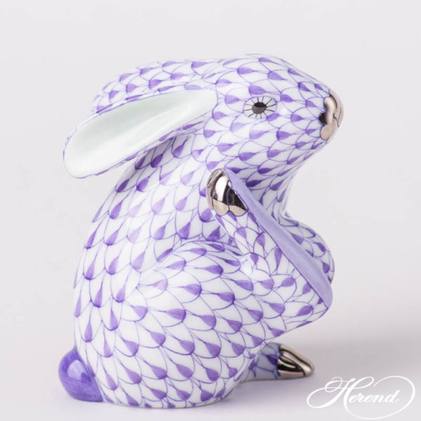 Rabbit (Bunny) is painted in Vieux Herend (VHL-PT) Lilac fish scale with Platinum design. This fishnet or fish scale pattern is a typical motif of Herend. It can be ordered in 14 different VH (fishnet/fish scale) colors. Figurine data Height: 7.5 cm (3"H) Width: 4.7cm (2"W) Length: 6.0 cm (2.5"L) Weight: 0.1 kg