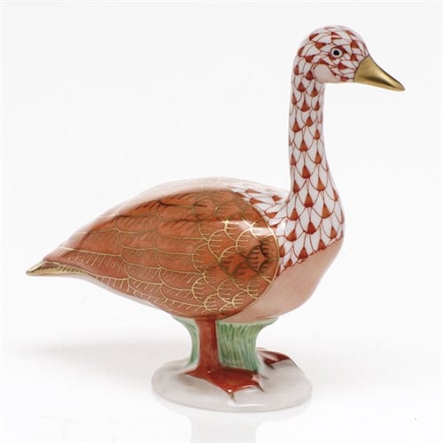 Herend Canada Goose Figurine - FIshnet Edition Canada's national animal our favourite Canada Goose is now available in collectible fishnet figurine. Herend porcelain from Hungary, handmade and handpainted with 24K gold accents.  4” x 1 ½” x 3 ⅞” h.